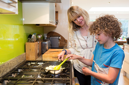 Mum and son cooking on gas